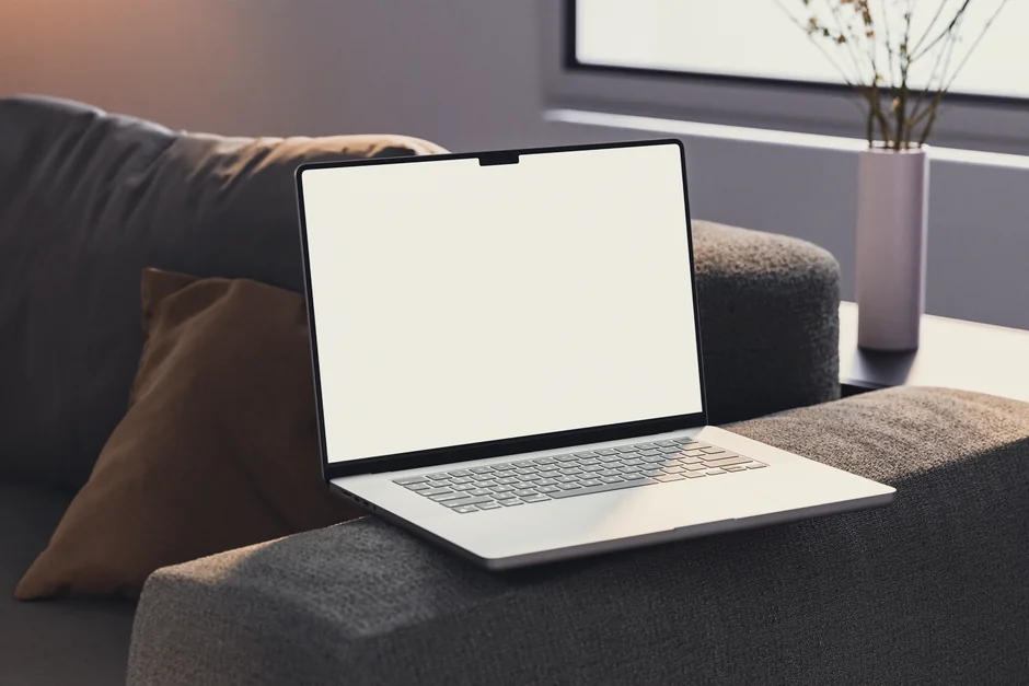 A tablet screen featuring images of minimalist decor emphasizing greenery and simple design.